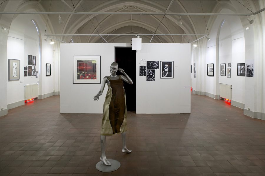 Silver Model wearing Tiger Morse dress, with The Backroom behind her