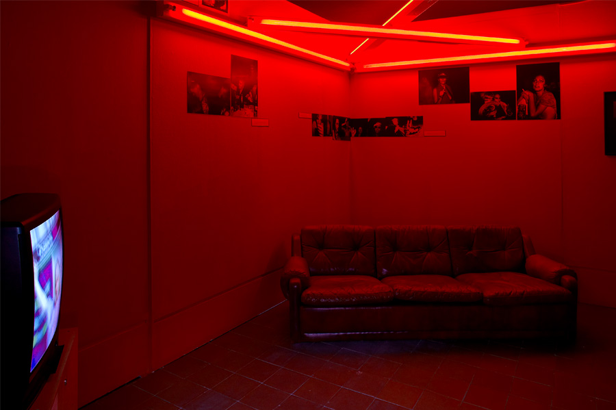 Backroom with Dan Flavin Red Neon Triangle Sculpture 