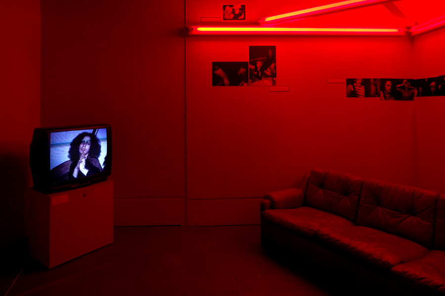 Backroom with Dan Flavin Red Neon Triangle Sculpture 