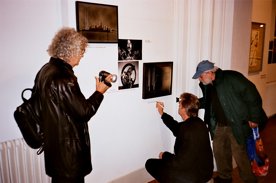 Anton Perich and Ira Schnieder documenting Frosty Myers writing text under his work